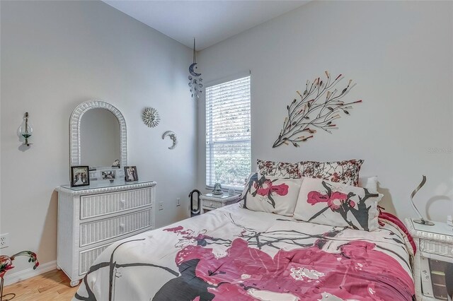 bedroom with light wood-type flooring