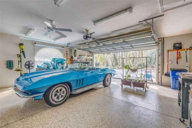 garage with ceiling fan and a garage door opener