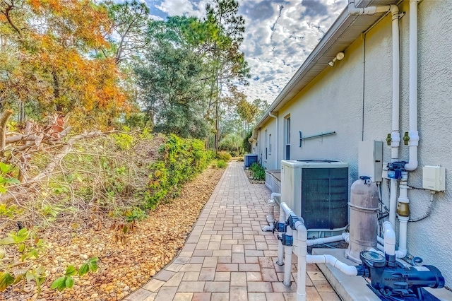 view of side of property featuring cooling unit