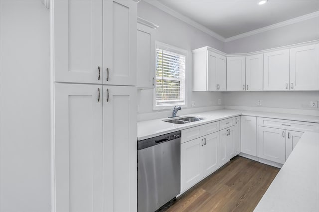 kitchen with sink, crown molding, dark wood-type flooring, white cabinetry, and stainless steel dishwasher