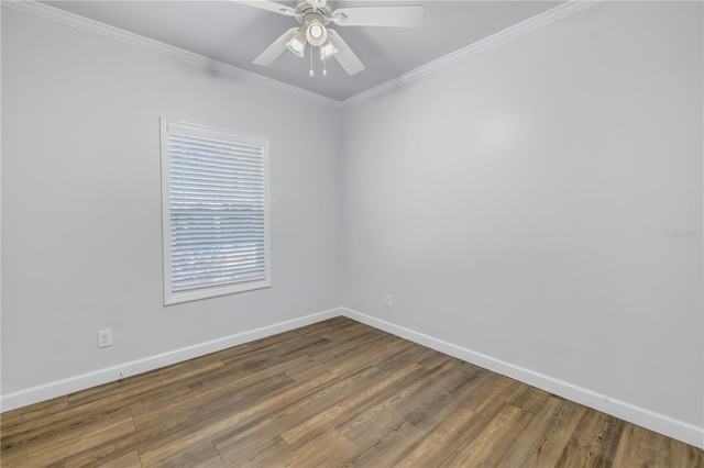 empty room with crown molding, wood-type flooring, and ceiling fan