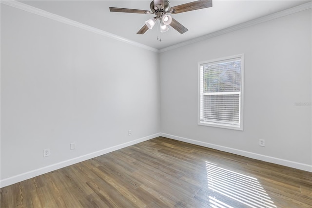 empty room with crown molding, ceiling fan, and hardwood / wood-style floors