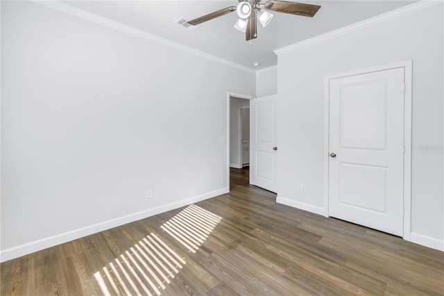 unfurnished bedroom featuring crown molding, ceiling fan, and dark hardwood / wood-style flooring