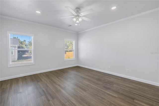 empty room with dark hardwood / wood-style flooring, crown molding, and ceiling fan