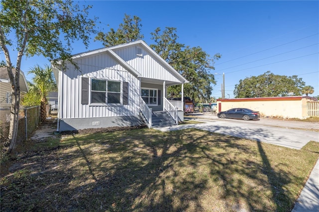 view of front of home featuring a front lawn and a porch