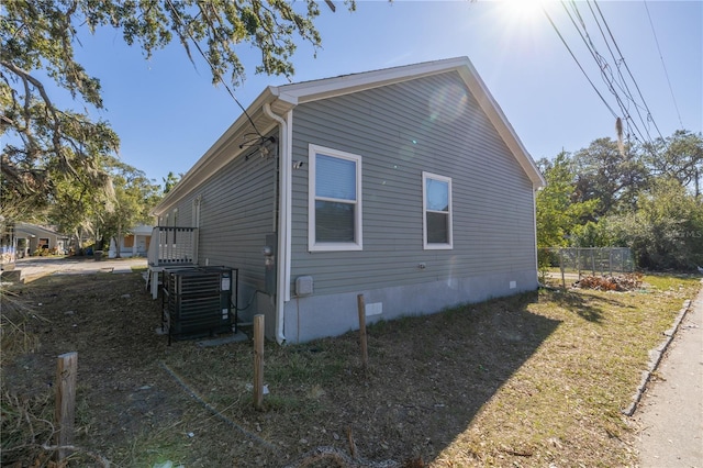 view of side of home featuring central air condition unit