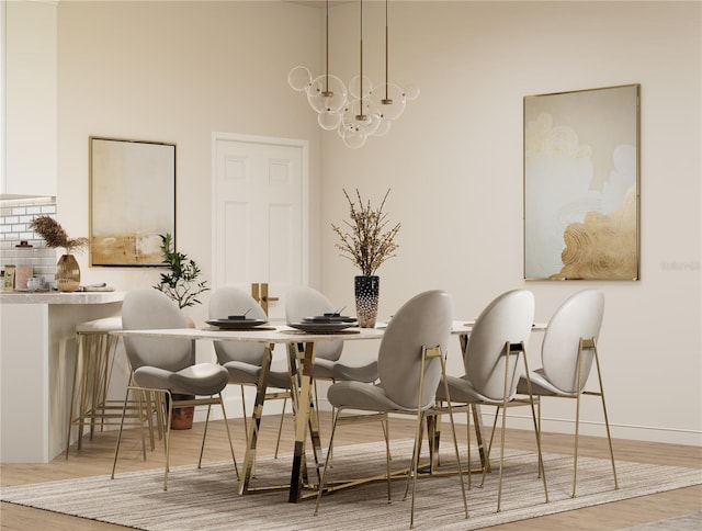 dining area featuring a chandelier and light hardwood / wood-style floors