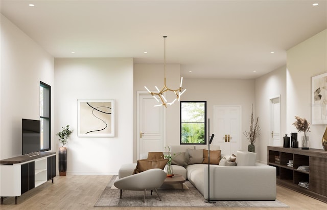 living room featuring a notable chandelier and light hardwood / wood-style floors