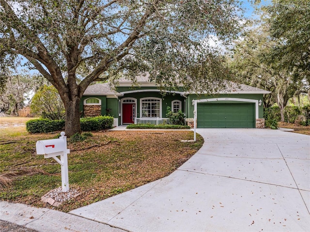 view of front of home with a porch and a garage