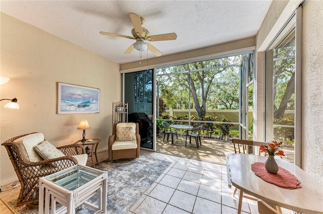 sunroom / solarium with ceiling fan