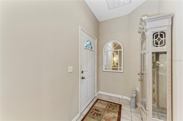 entryway featuring light tile patterned flooring