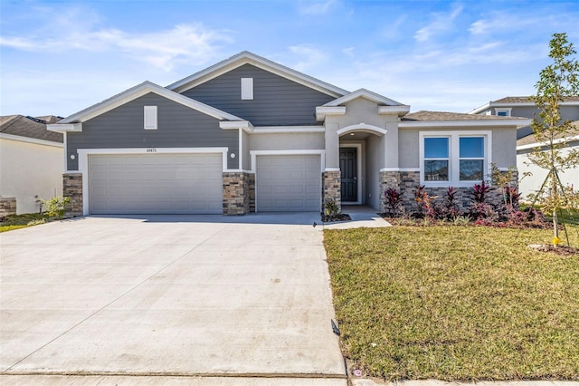 view of front of home with a garage and a front yard