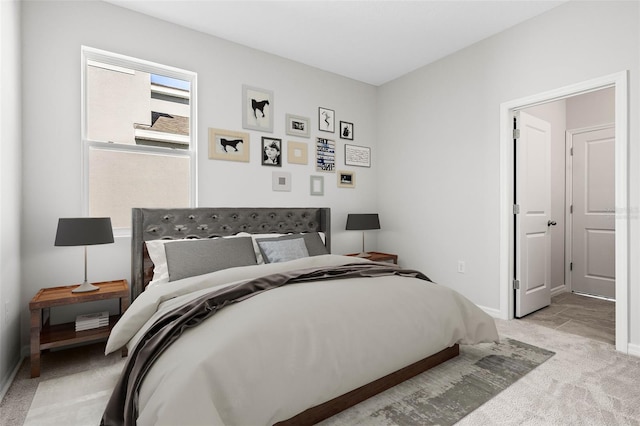 bedroom featuring light colored carpet