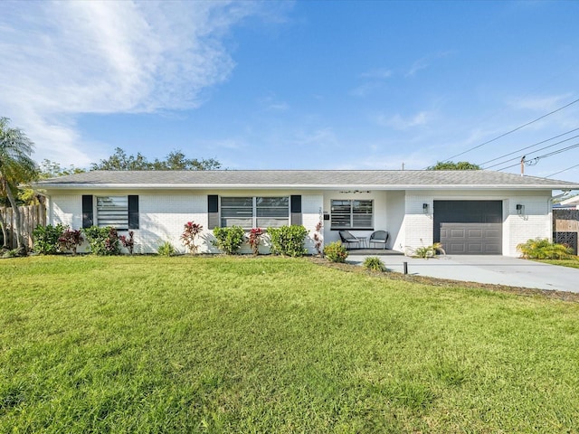 ranch-style house with a garage and a front lawn