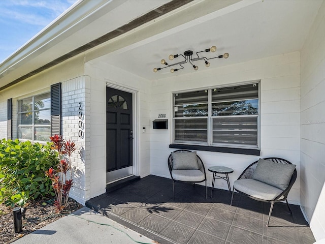 property entrance featuring a porch