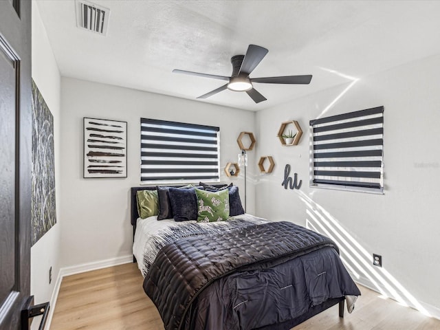 2000 57th St N, Saint Petersburg, FL 33710 - bedroom featuring light wood-type flooring and ceiling fan