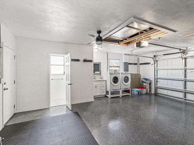 2000 57th St N, Saint Petersburg, FL 33710 - garage featuring ceiling fan, washer and clothes dryer, and a garage door opener