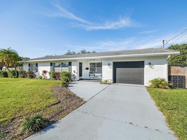 2000 57th St N, Saint Petersburg, FL 33710 - ranch-style house featuring a front lawn, a porch, and a garage