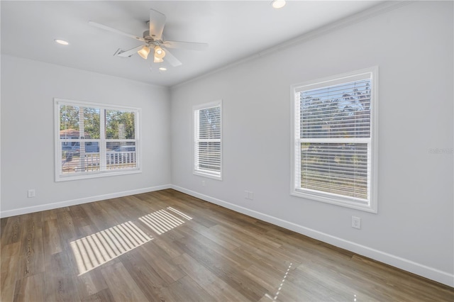 unfurnished room featuring hardwood / wood-style floors, ornamental molding, and ceiling fan