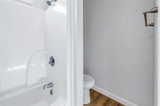 bathroom with hardwood / wood-style floors and toilet