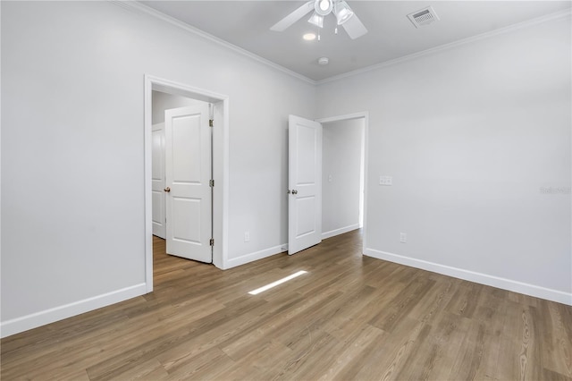 unfurnished bedroom featuring crown molding, ceiling fan, and light wood-type flooring