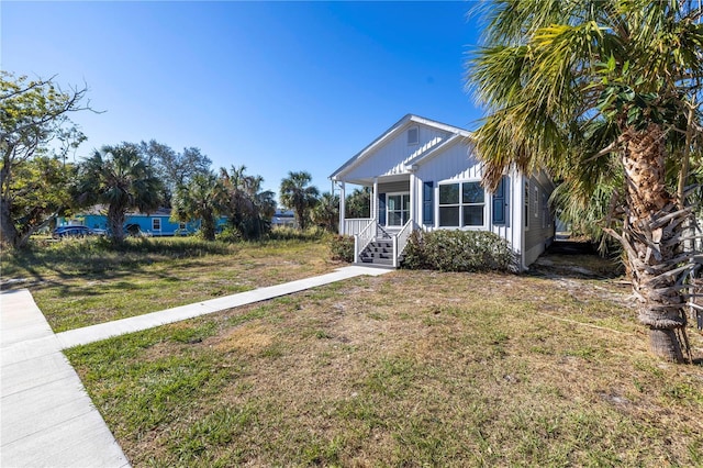 view of front of property with a front lawn and a porch