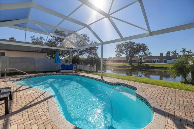 view of swimming pool with a lanai, a water view, and a patio