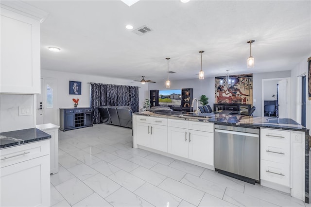 kitchen featuring white cabinetry, hanging light fixtures, ceiling fan, and stainless steel dishwasher