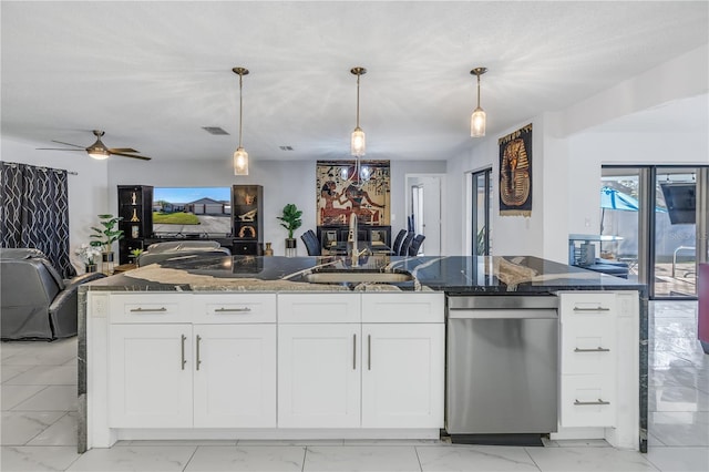 kitchen with white cabinets, ceiling fan, and hanging light fixtures