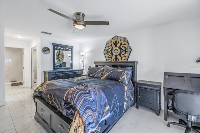 bedroom with ensuite bath and ceiling fan