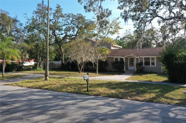 single story home featuring a front yard