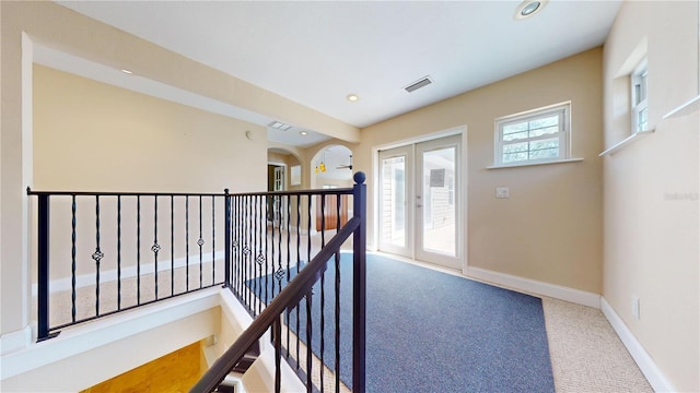 1149 Sedeeva St, Clearwater, FL 33755 - corridor with baseboards, visible vents, an upstairs landing, and carpet floors