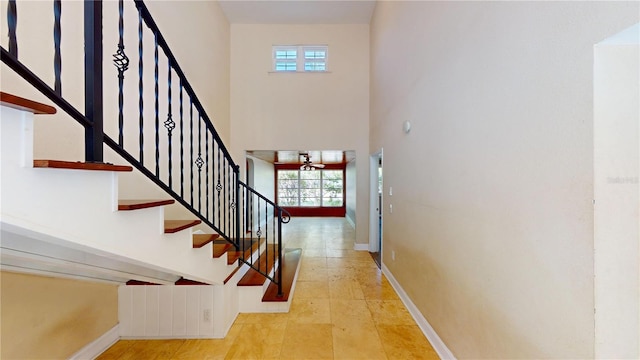 1149 Sedeeva St, Clearwater, FL 33755 - stairway featuring a towering ceiling and baseboards