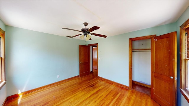 1149 Sedeeva St, Clearwater, FL 33755 - unfurnished bedroom featuring baseboards, ceiling fan, a closet, and light wood finished floors