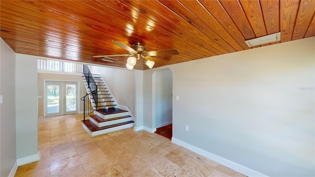 1149 Sedeeva St, Clearwater, FL 33755 - stairs featuring baseboards, arched walkways, french doors, and wood ceiling