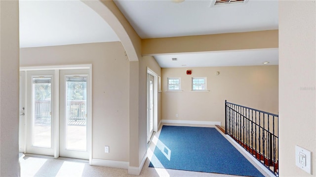1149 Sedeeva St, Clearwater, FL 33755 - corridor with arched walkways, carpet flooring, visible vents, and baseboards