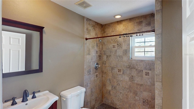 1149 Sedeeva St, Clearwater, FL 33755 - full bathroom featuring a sink, visible vents, toilet, and a tile shower
