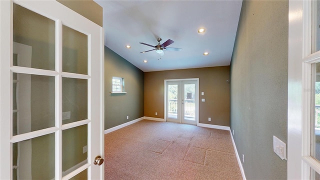 1149 Sedeeva St, Clearwater, FL 33755 - carpeted spare room with baseboards, ceiling fan, recessed lighting, lofted ceiling, and french doors