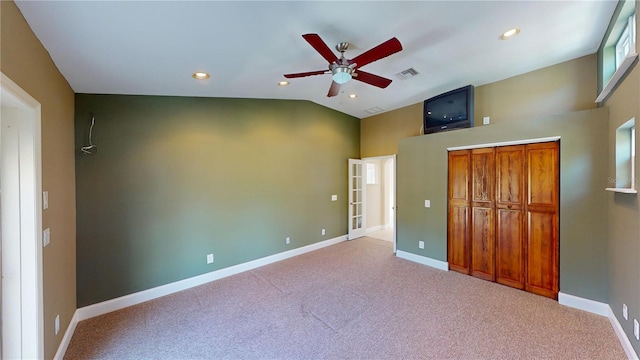 1149 Sedeeva St, Clearwater, FL 33755 - unfurnished bedroom featuring carpet floors, baseboards, lofted ceiling, and visible vents