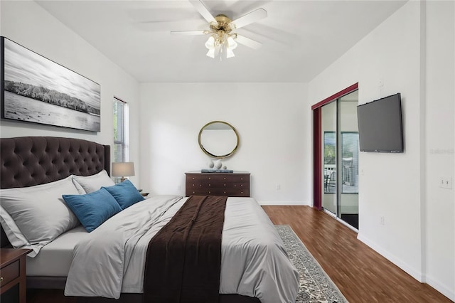 bedroom with ceiling fan and dark wood-type flooring