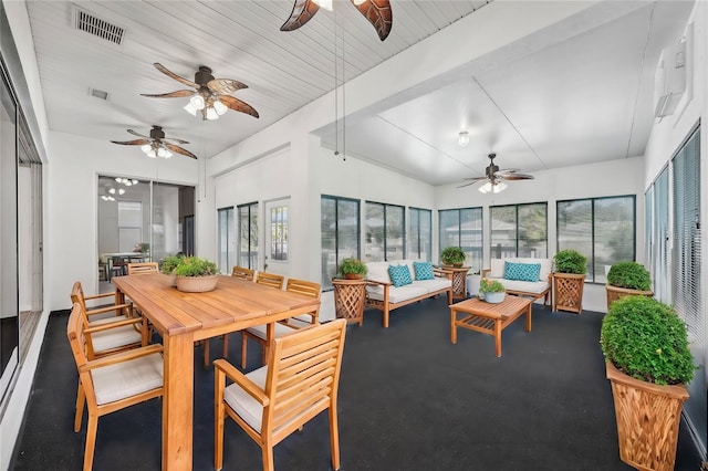 sunroom / solarium with plenty of natural light and wood ceiling