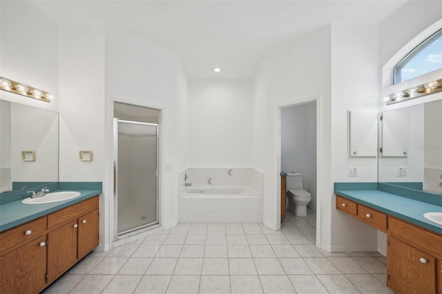 full bathroom with tile patterned flooring, vanity, toilet, and independent shower and bath