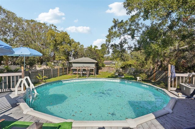 view of swimming pool featuring a wooden deck