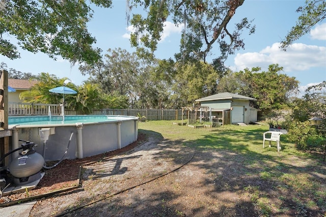 view of yard with a fenced in pool and an outdoor structure