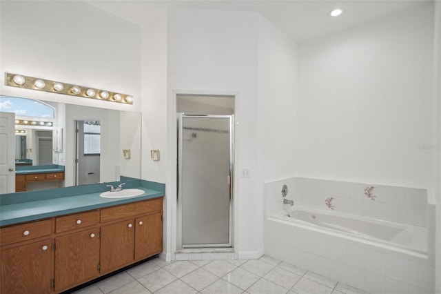 bathroom with vanity, tile patterned floors, and independent shower and bath