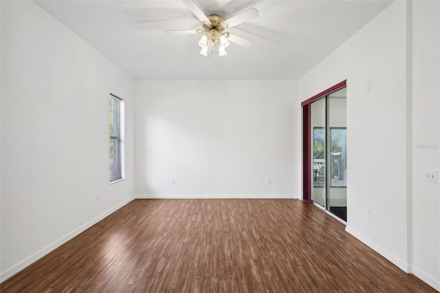 spare room featuring ceiling fan and dark hardwood / wood-style flooring