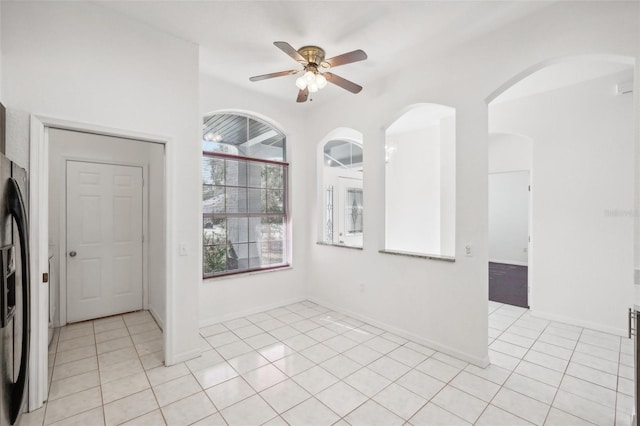 unfurnished room featuring ceiling fan and light tile patterned floors