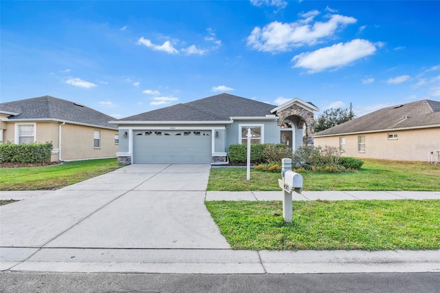 ranch-style home featuring a garage and a front lawn