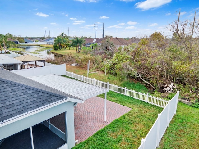 view of yard with a gazebo, a patio area, and a water view