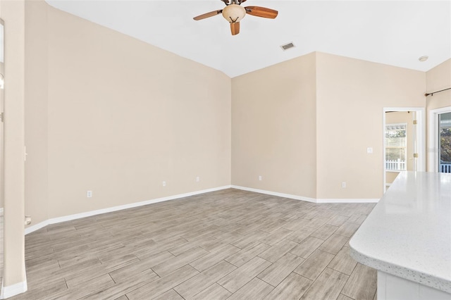 unfurnished living room with light hardwood / wood-style flooring, ceiling fan, and lofted ceiling